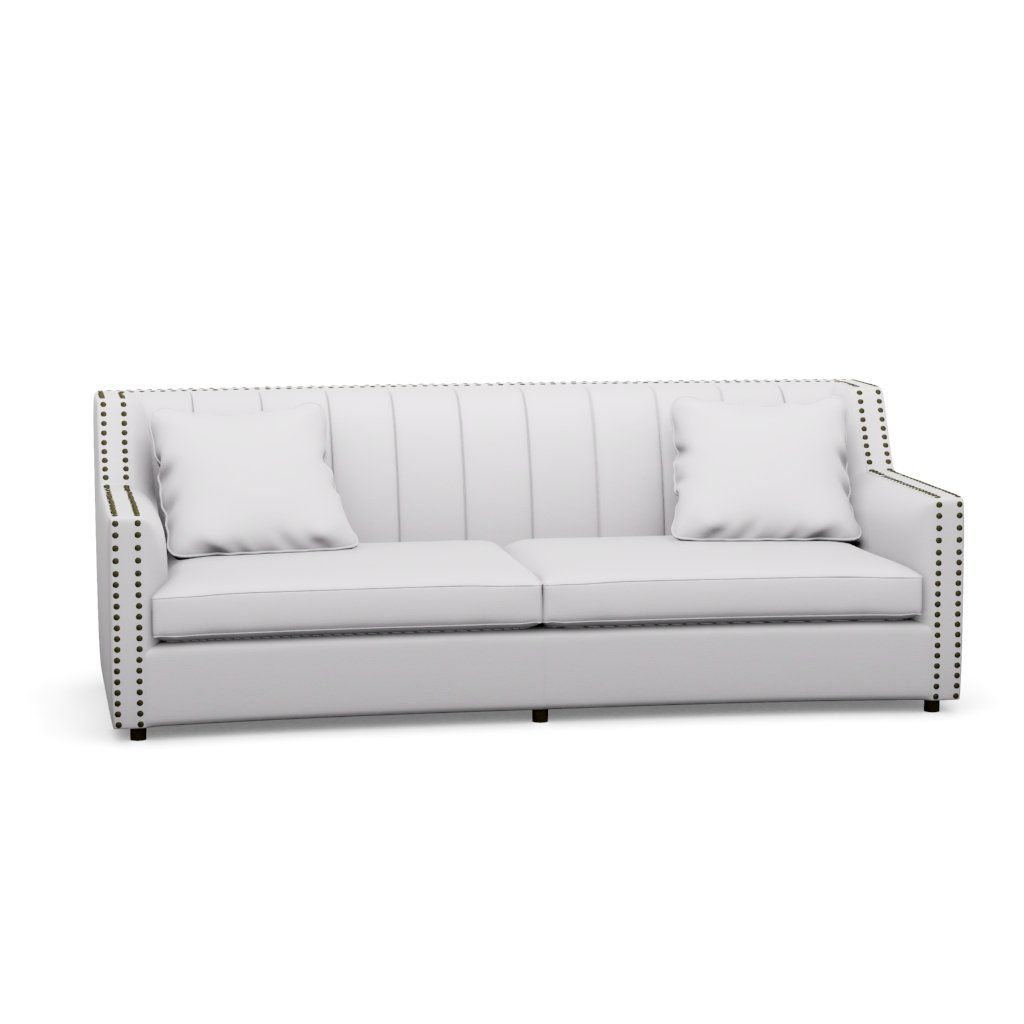 A white couch with pillows on it on a white background