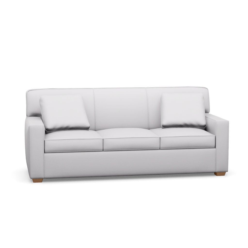 A white couch with three pillows on a white background.