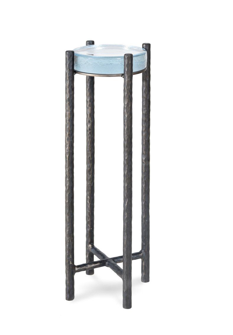 A metal stand with a blue bowl on top of it.