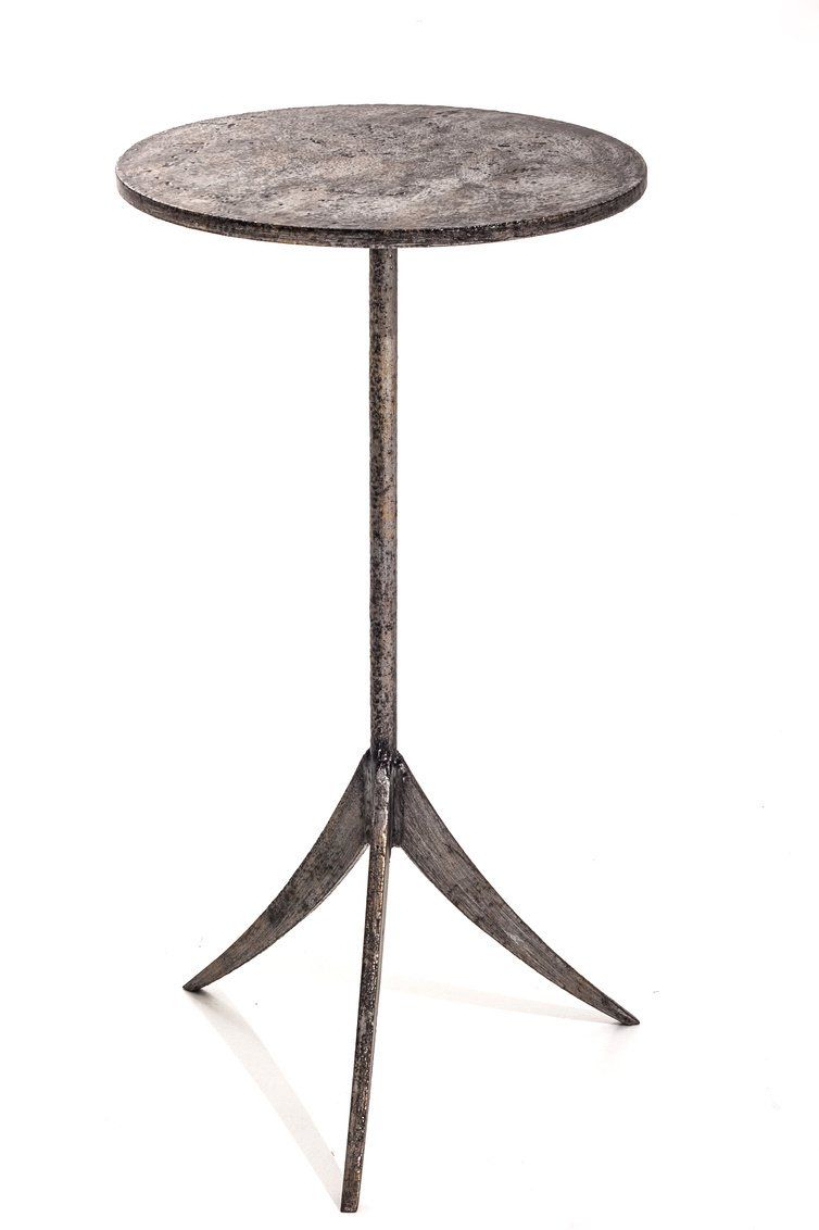 A small round table with a tripod base on a white background.