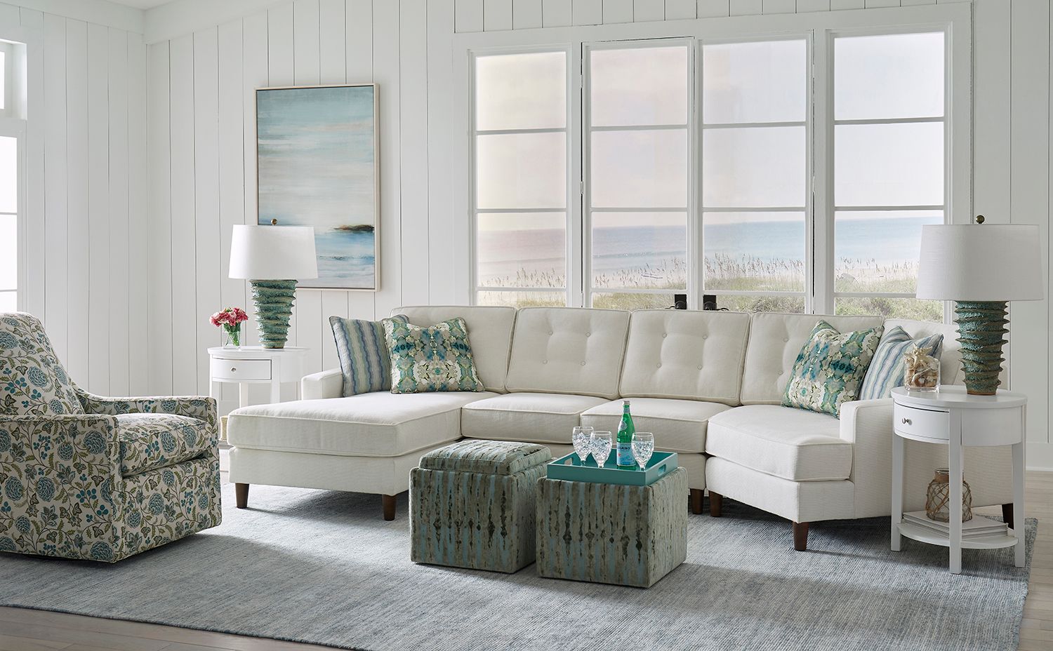 A dining room with a table and chairs and a bench