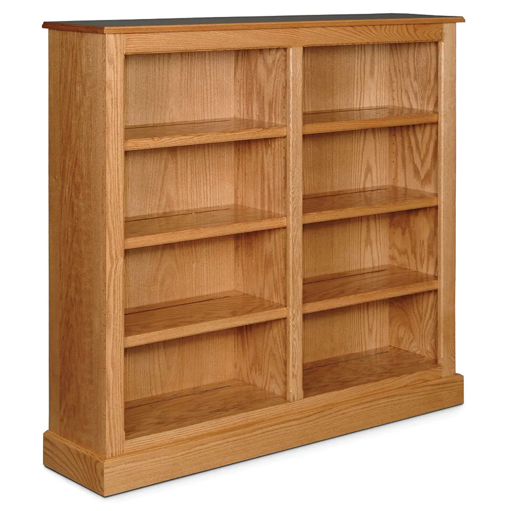 A wooden bookcase with lots of shelves on a white background