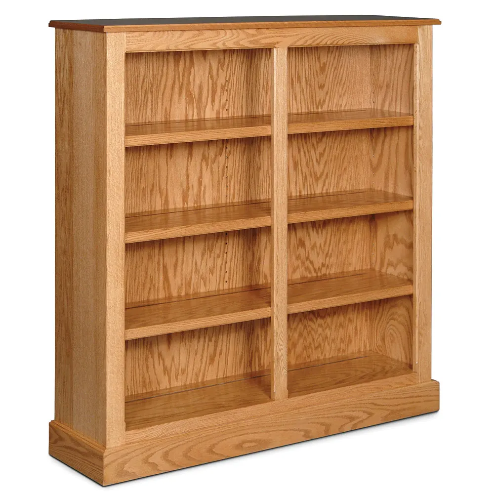 A wooden bookcase with lots of shelves on a white background