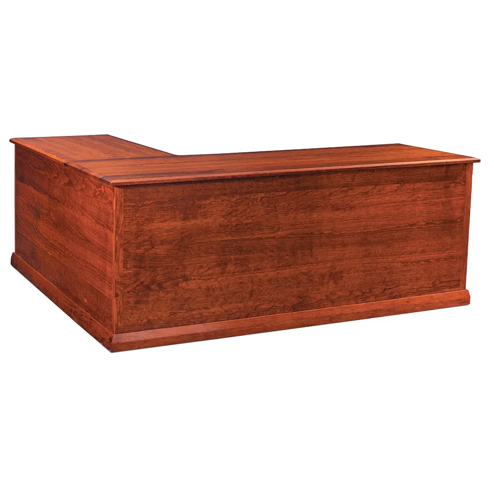 A wooden l shaped desk on a white background