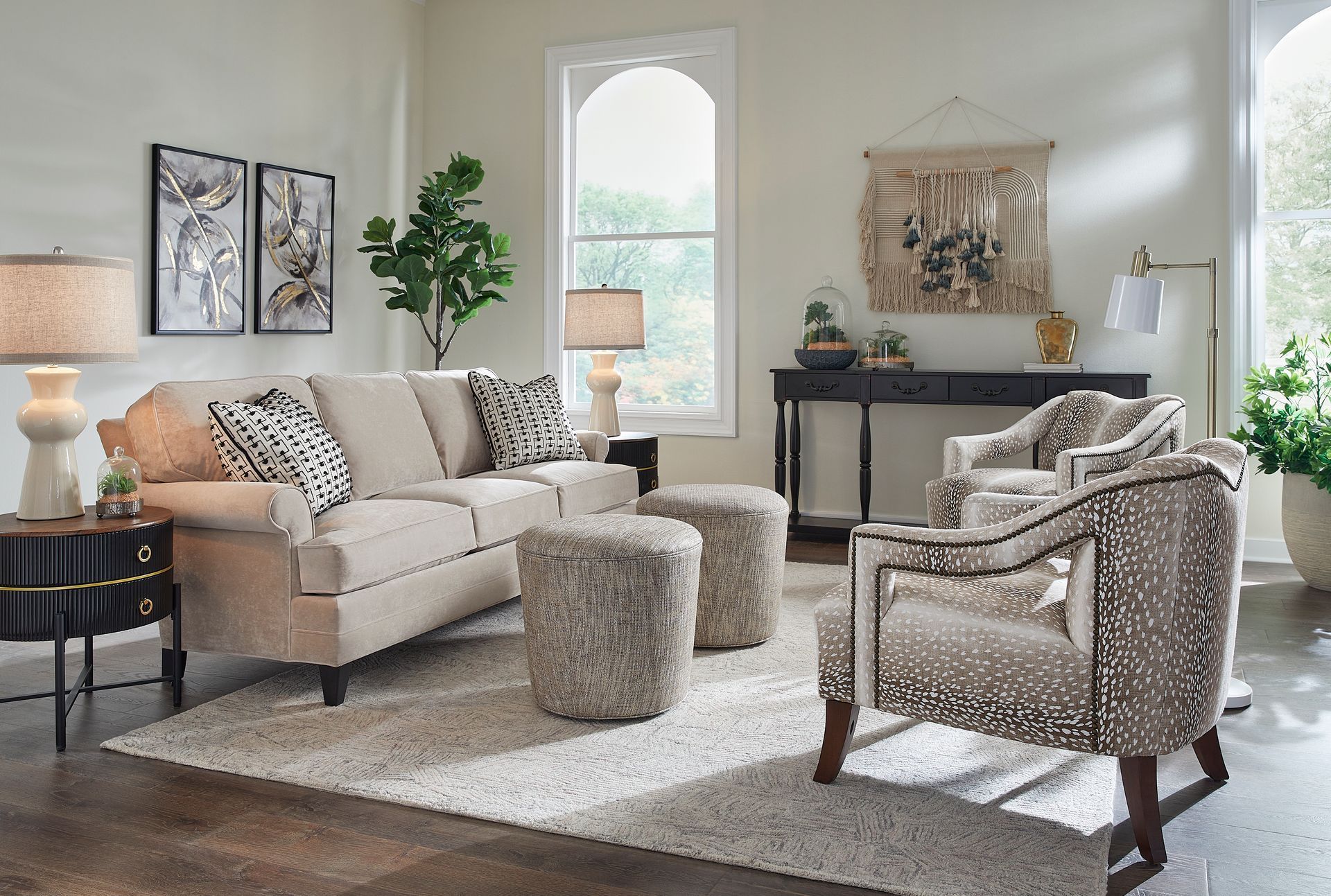 A living room with a couch , chair and coffee table