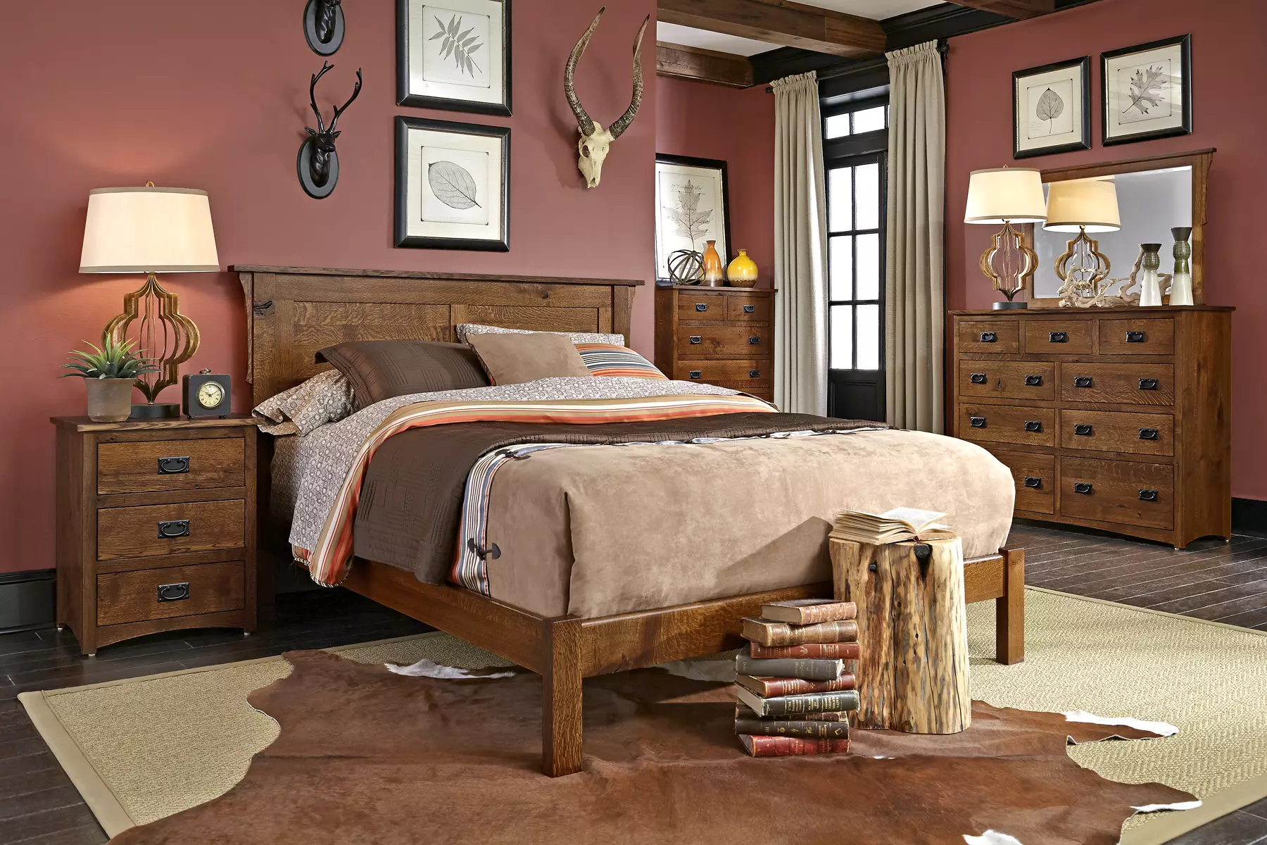 A bedroom with a bed , dresser , nightstand , and rug.
