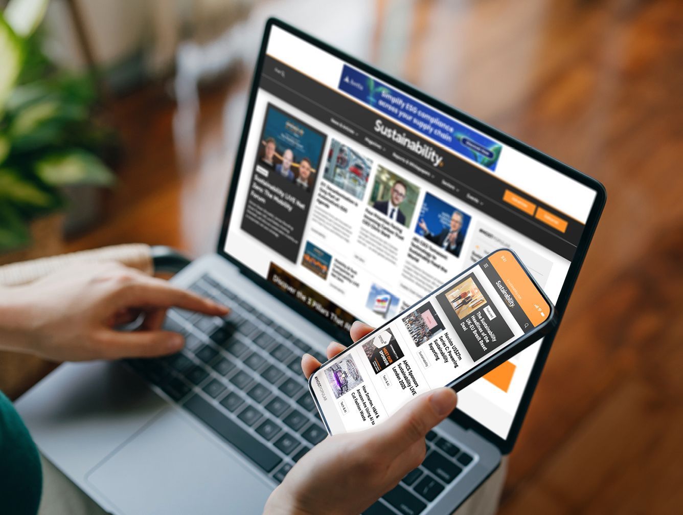 A person is on BizClik's Sustainability Magazine sites on their laptop and phone