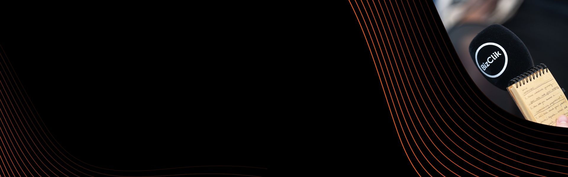 A black background with BizClik Microphone
