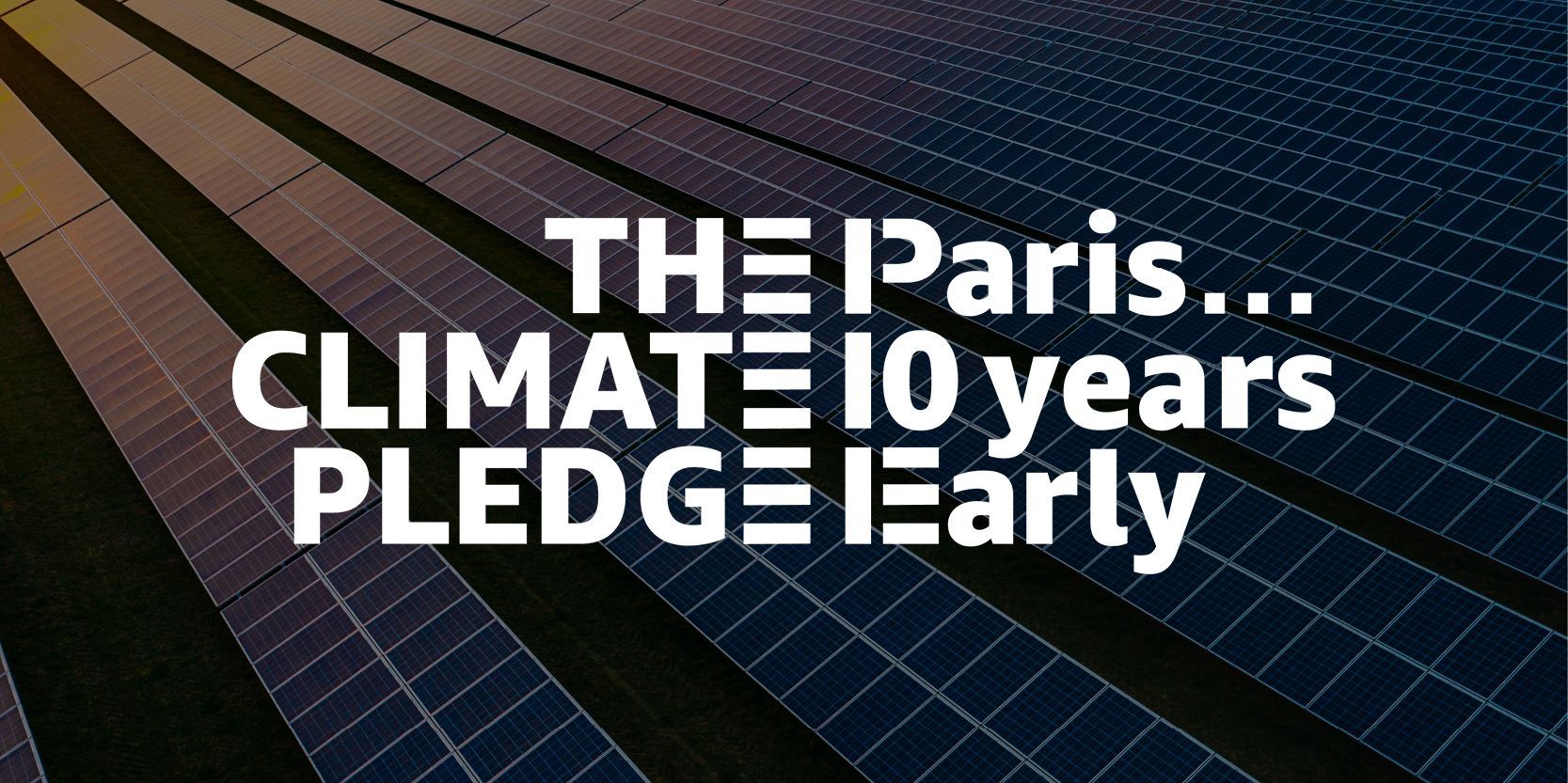Text overlay on a background of solar panels: 