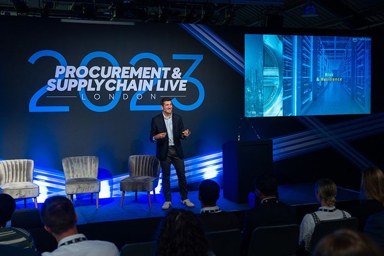 A man is giving a presentation at a procurement and supply chain live event