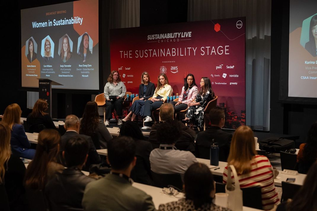 A group of people standing in front of a sign that says sustainability live