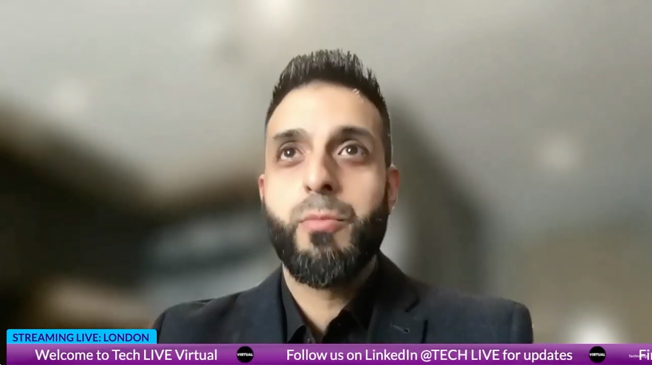 A man with a beard is talking on a video call