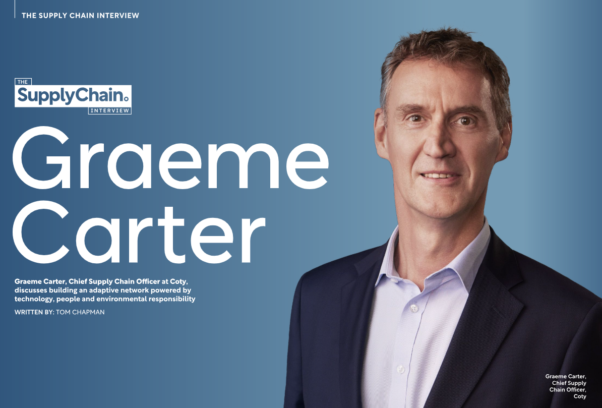 Graeme Carter in a blue jacket, smiling in front of a blue background. Text reads 