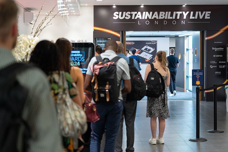 A group of people standing in front of a sign that says sustainability live london