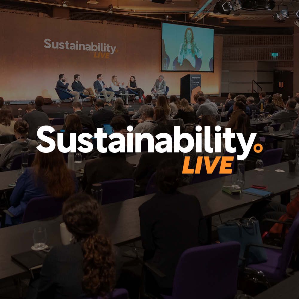 A group of people standing in front of a sign that says sustainability live