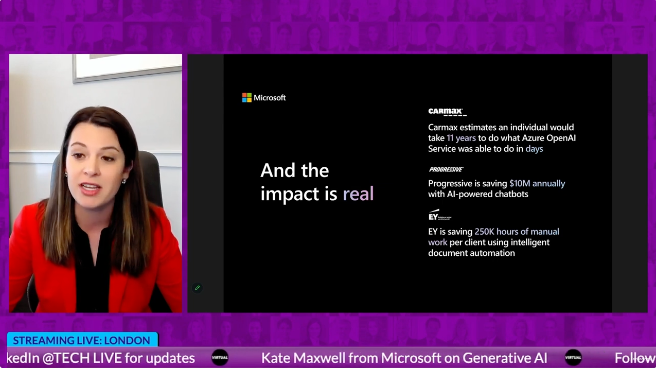 A woman in a red jacket is talking on a video call.