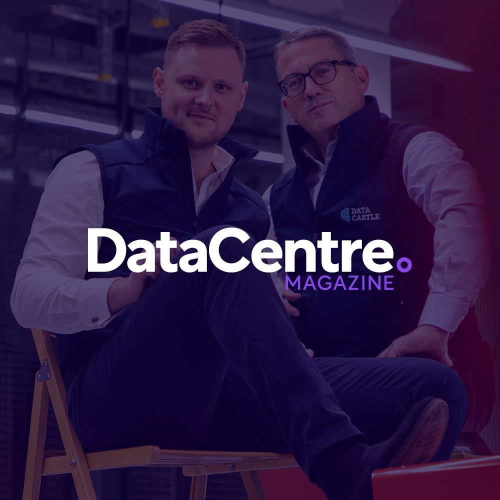 Two men are sitting in chairs in front of a data centre magazine logo.
