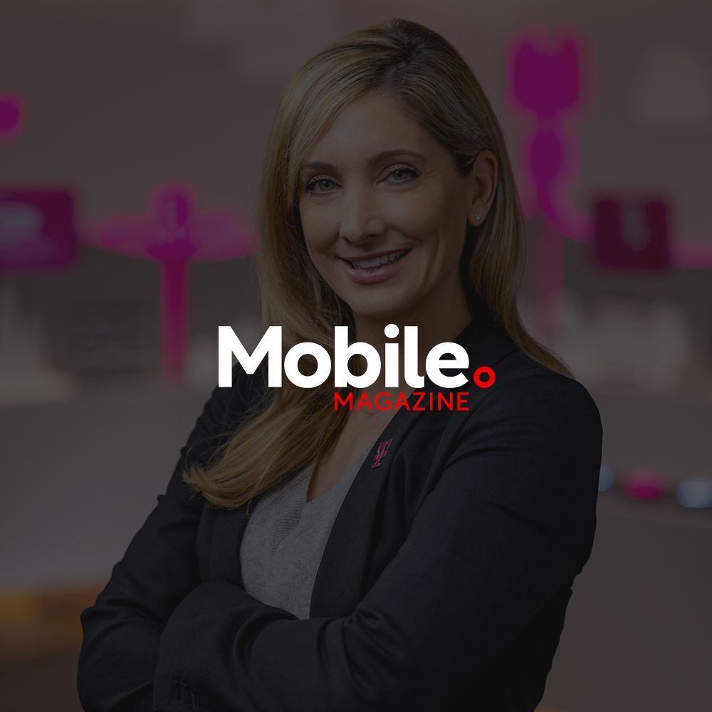A woman is smiling in front of a mobile magazine logo