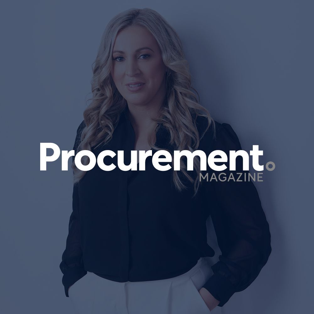 A woman is standing in front of a procurement magazine logo.