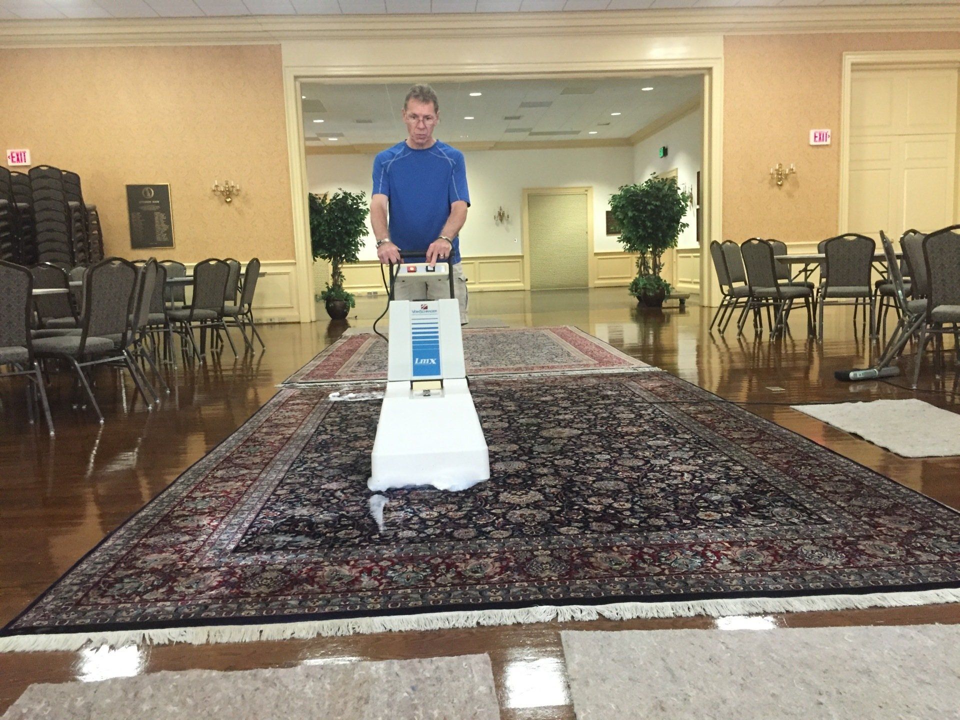 Royal Carpet & Upholstery Cleaners — Man Cleaning Carpet in Charlottesville, VA