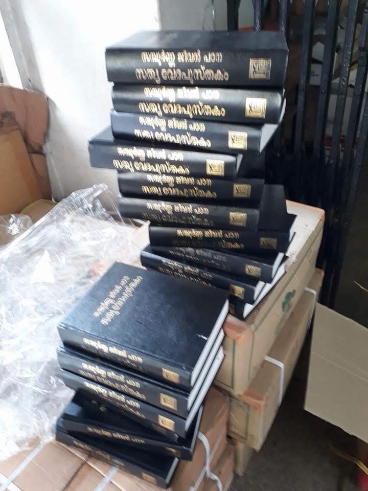 A stack of black books on top of each other
