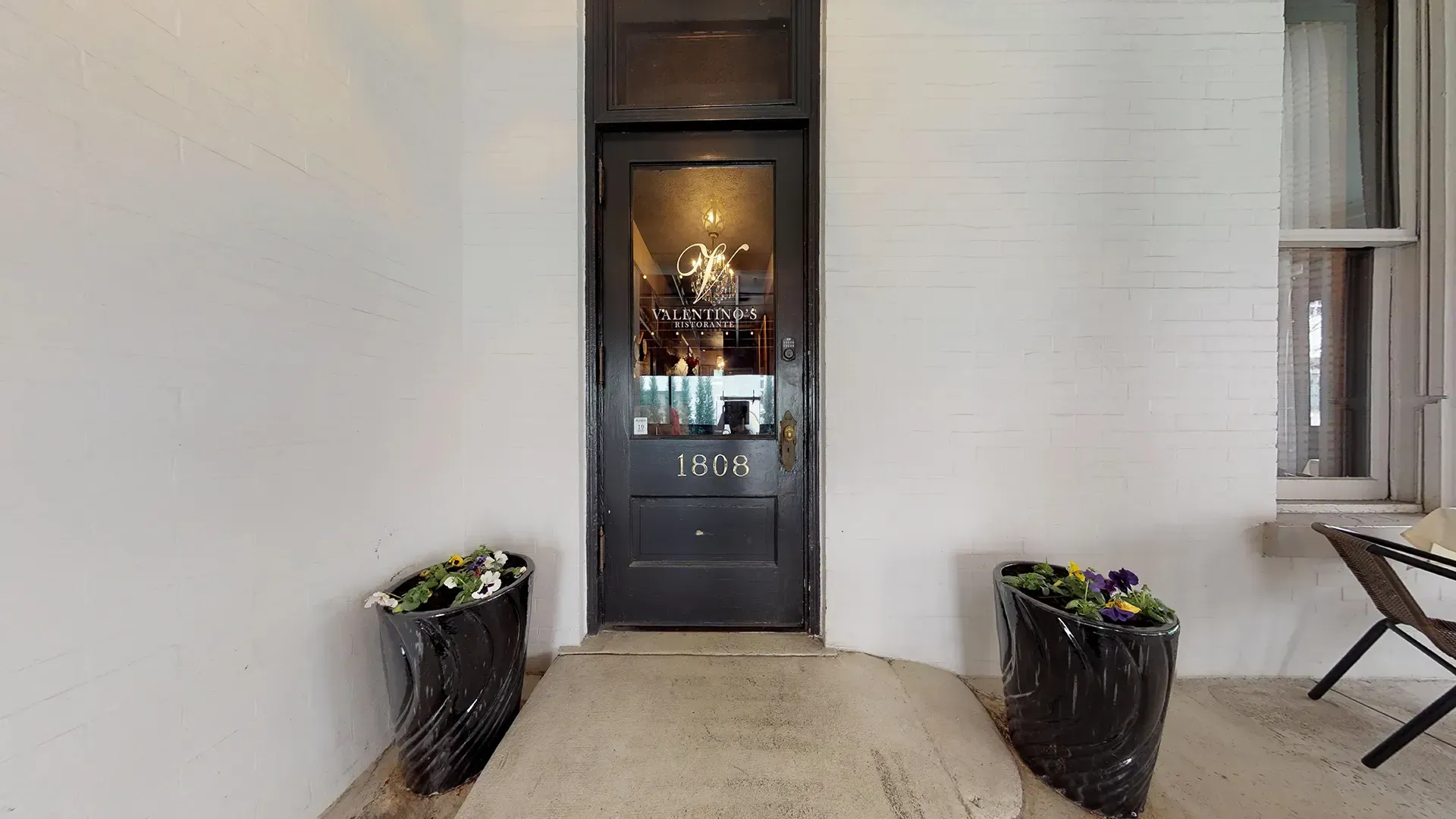 A black door with the number 1206 on it