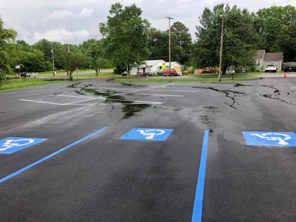 A parking lot with handicap signs painted on it