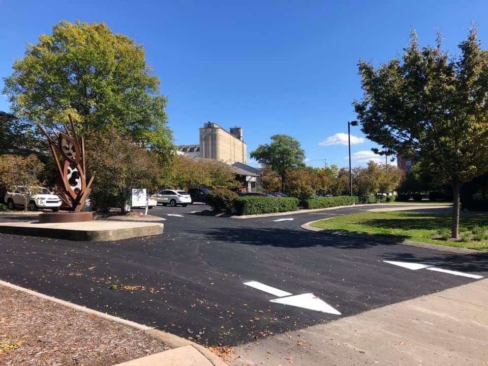There is a statue in the middle of the parking lot.