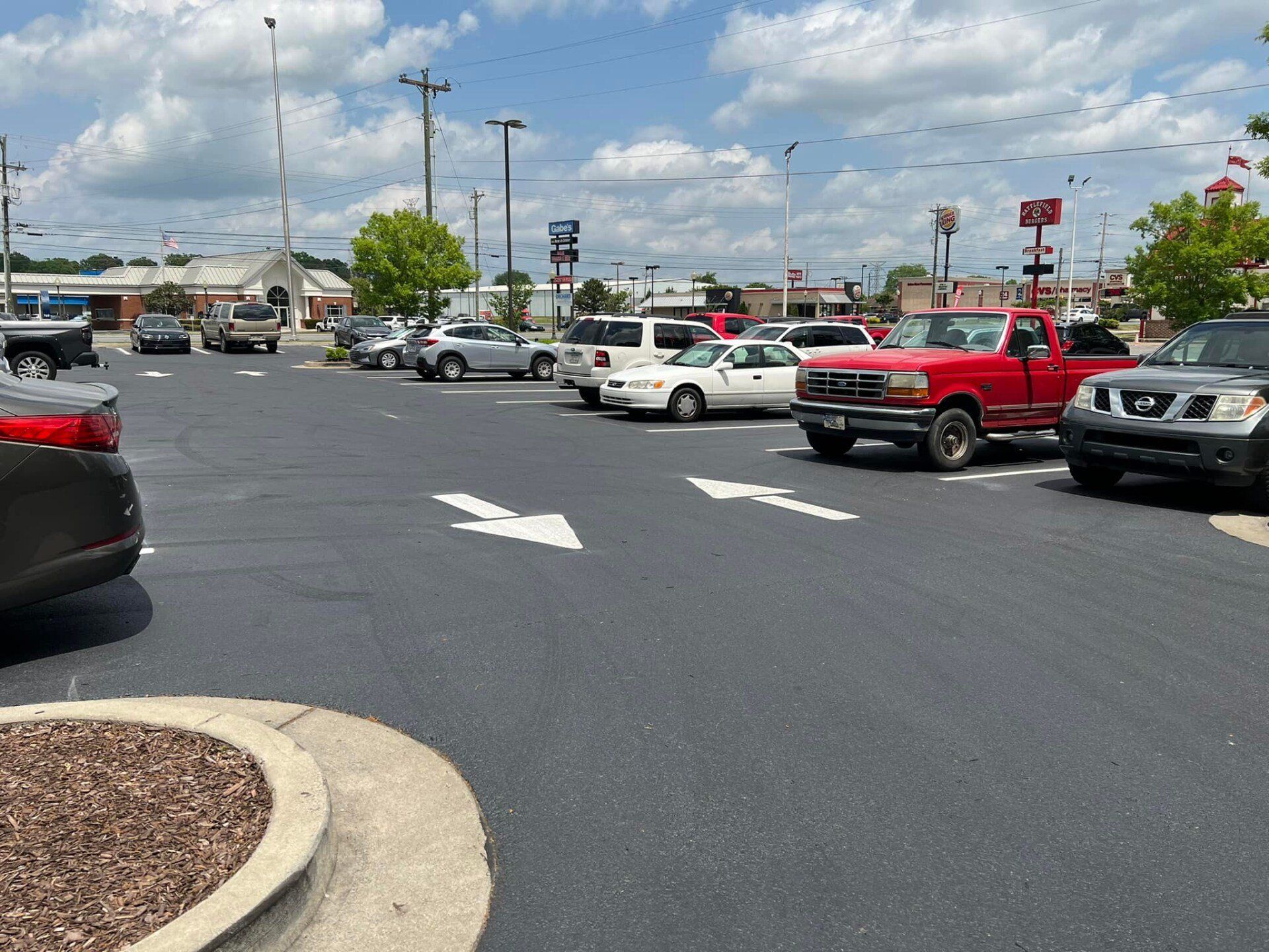 A lot of cars are parked in a parking lot.