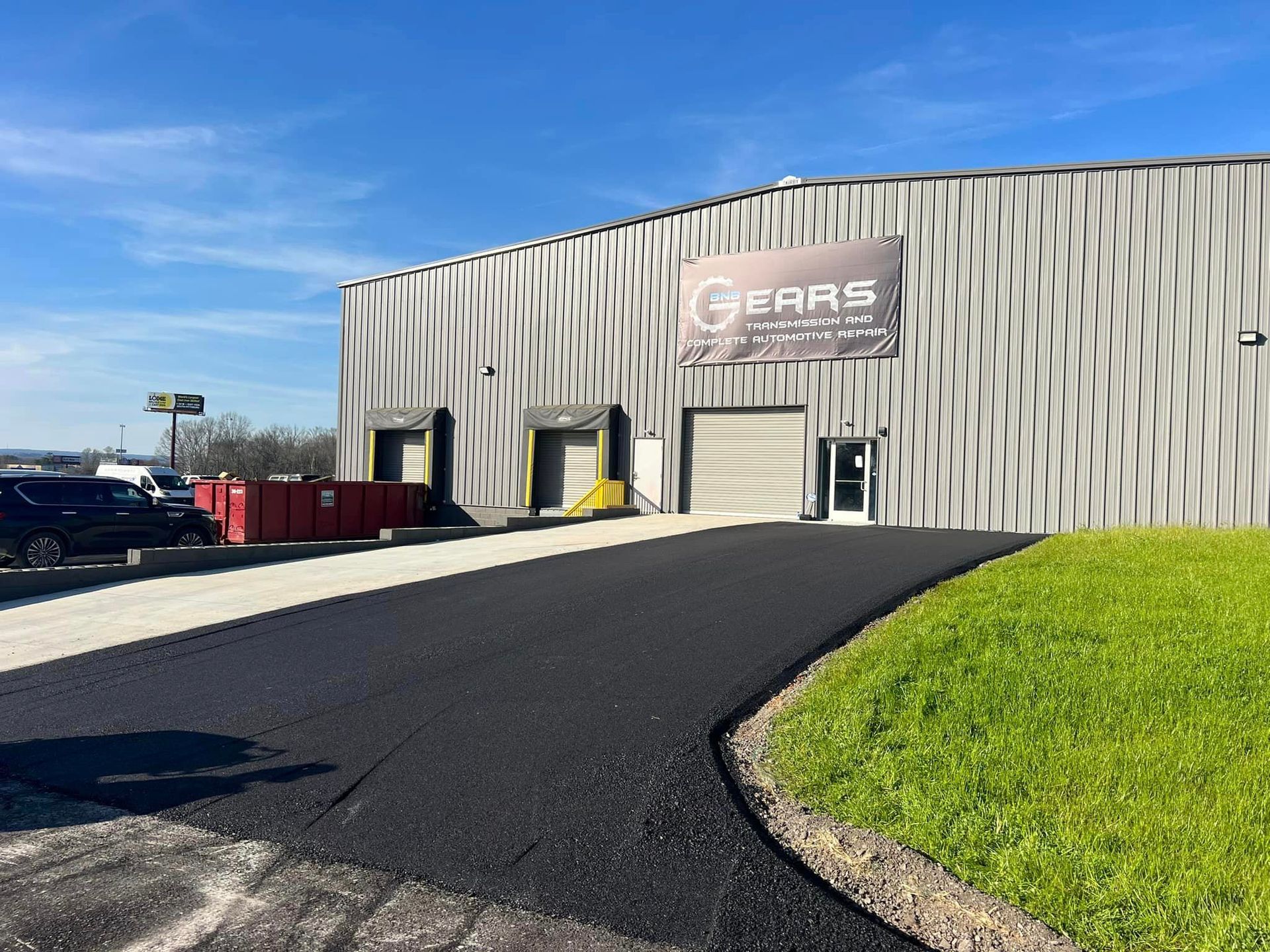 A large building with a sign that says gears on it.