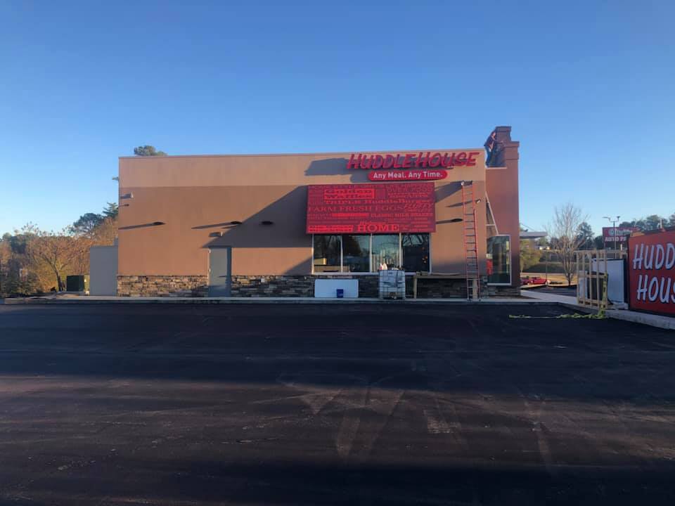A building with a red sign that says hudson house
