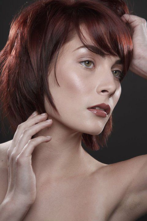 Red haired woman posing for camera