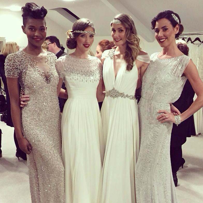 Group of women wearing wedding dresses