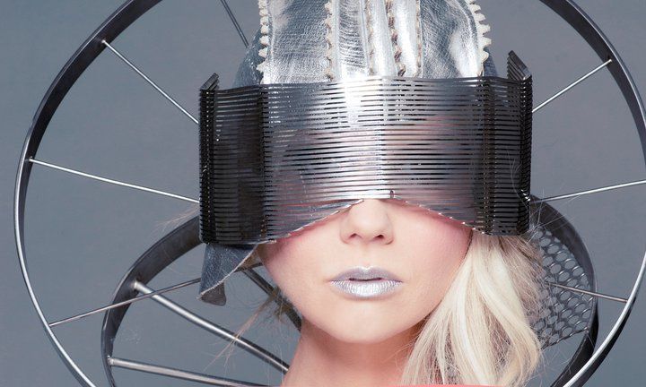 Close-up of woman with tape around her eyes and silver lips and make-up