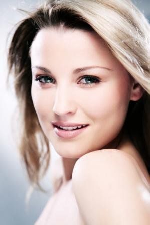 Pretty woman looking directly at camera with natural make-up