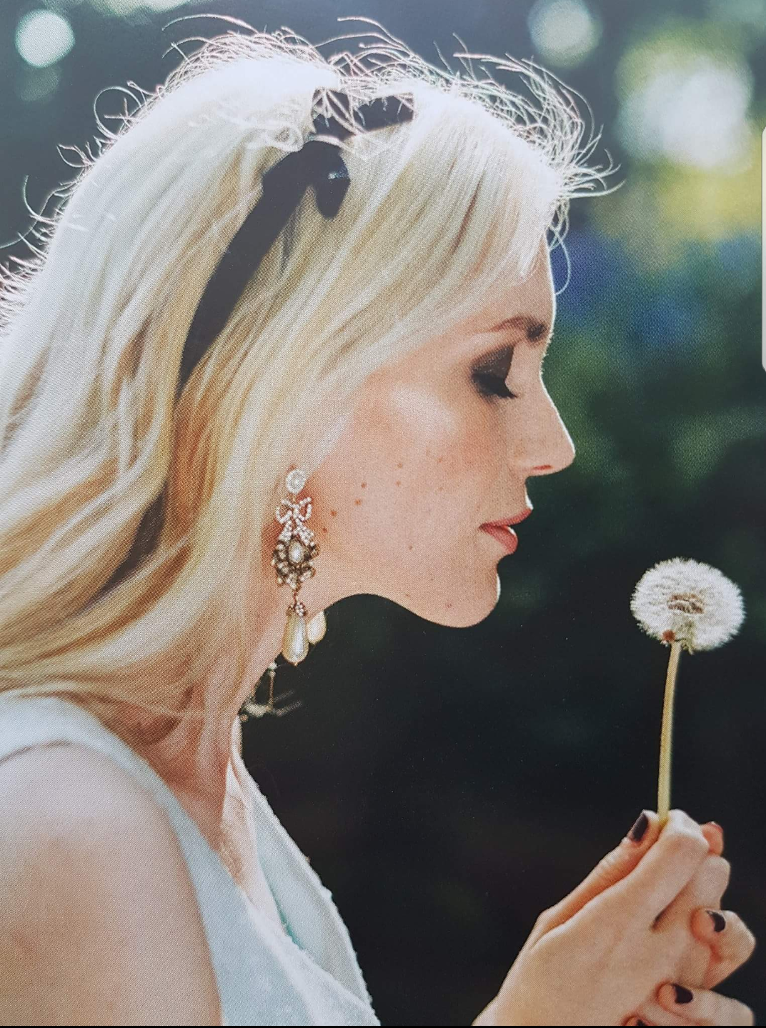 Bride holding dandelion