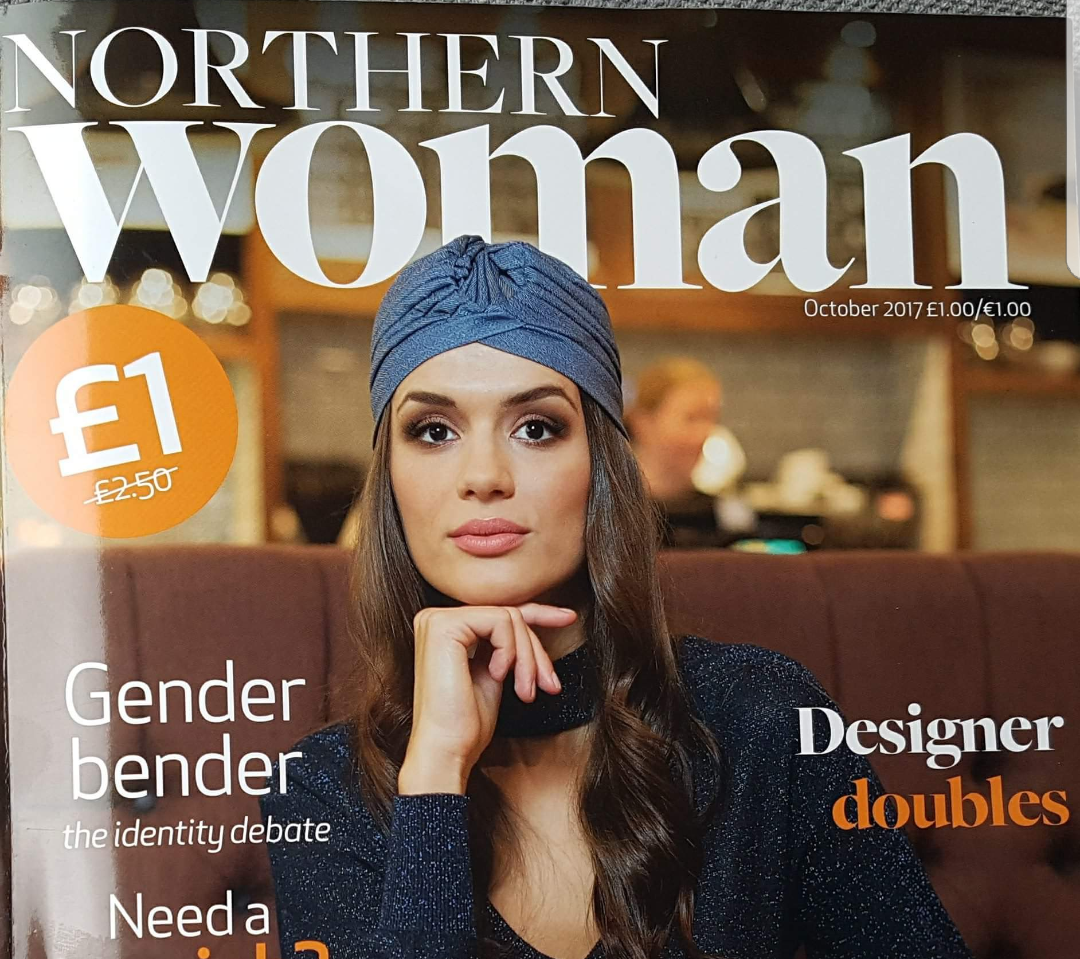Northern Woman cover with woman wearing blue bandana sat at restaurant table