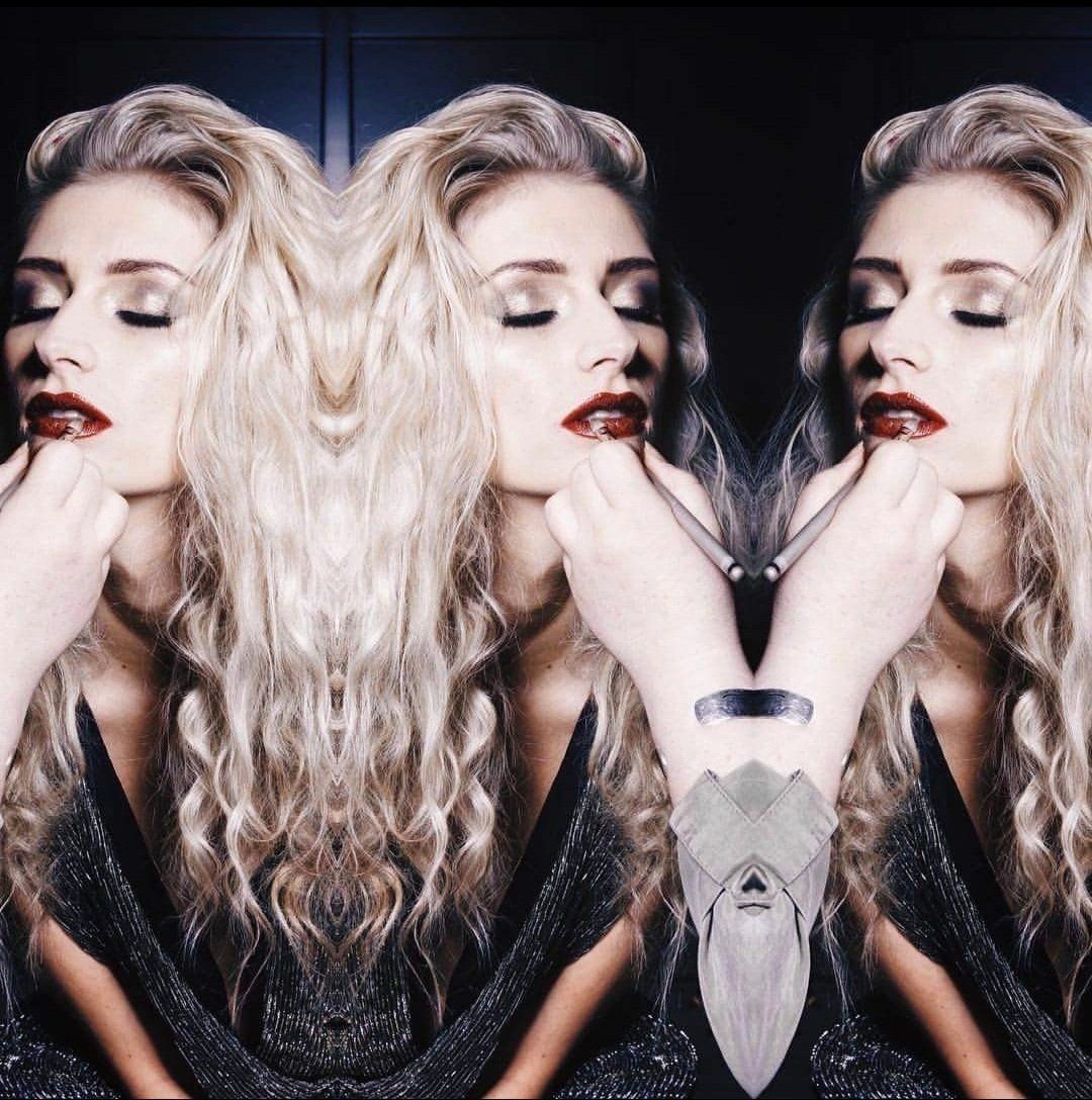 Woman wearing red lips and her reflection twice