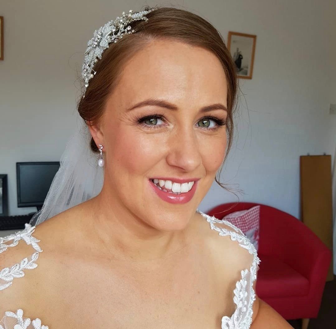 Ginger bride smiling at camera