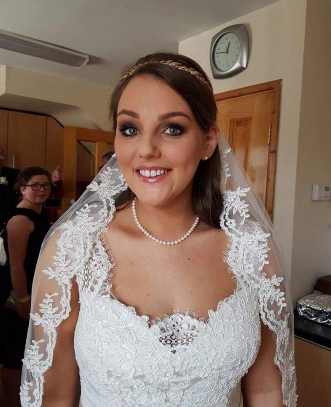 Bride pulling large grin to camera