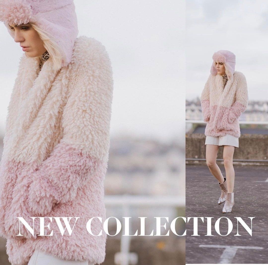 Ad with woman in pink hooded jumper looking cold