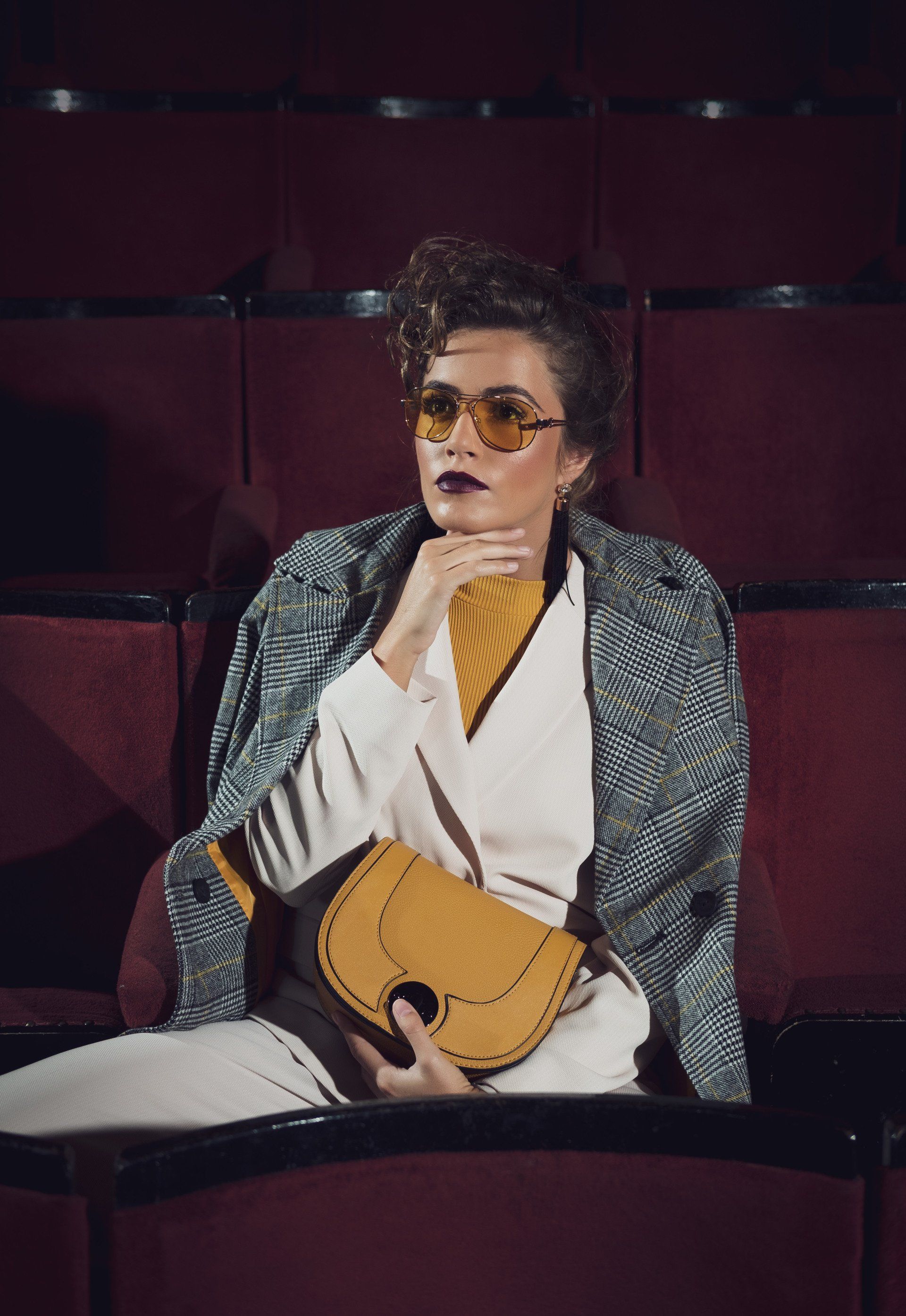 Woman looking opulent sat in theatre
