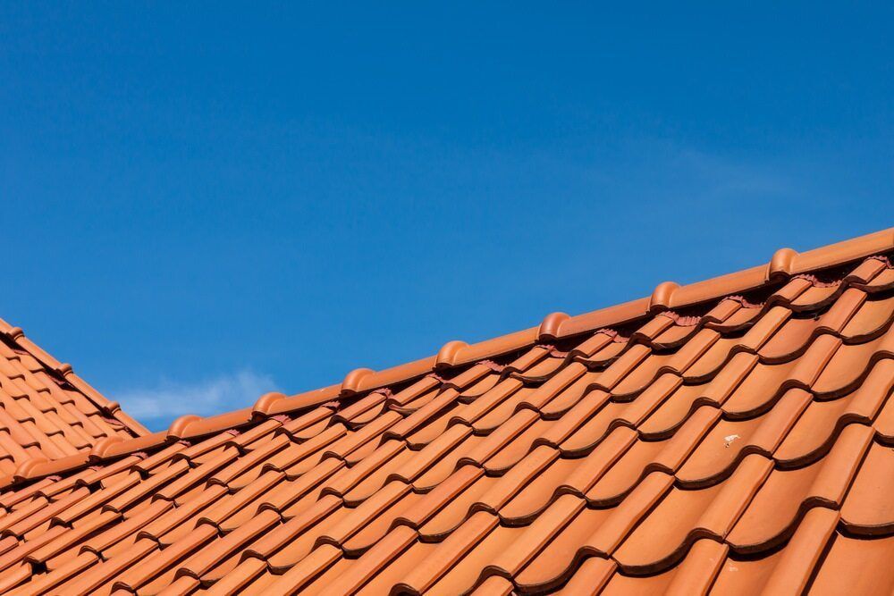 Orange Tile Roof Against a Clear Blue Sky — Whirly Bird King in Bribie Island, QLD