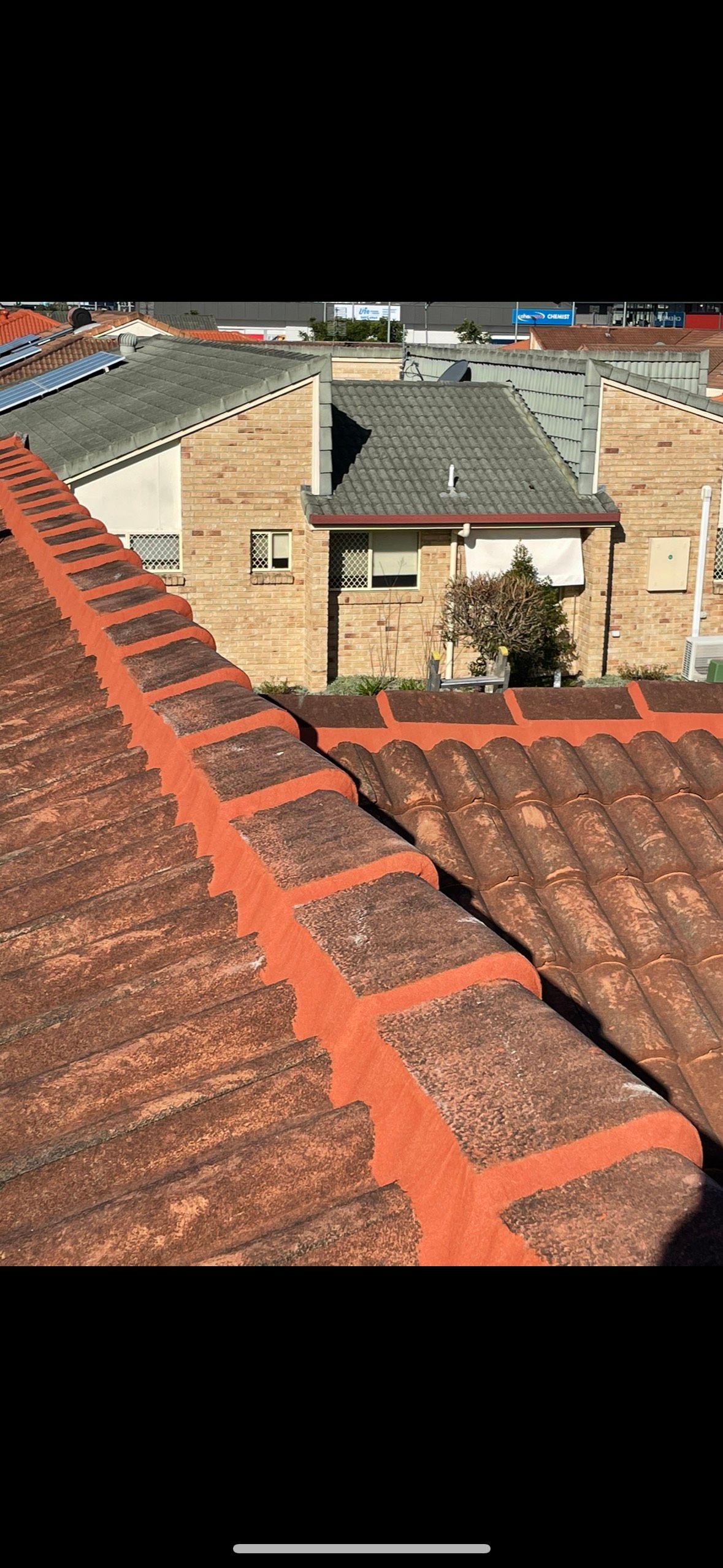 Close-up of a Terracotta Tile Roof, With Red Ridge Tiles — Whirly Bird King in Buderim, QLD