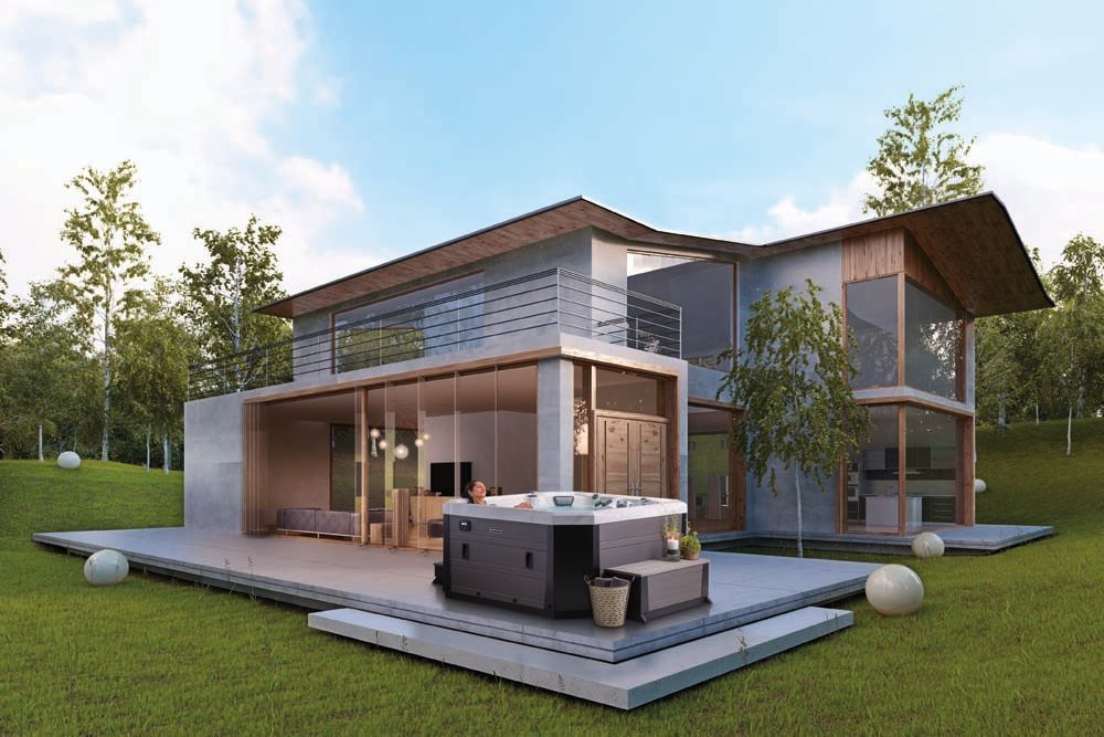 A modern house with a hot tub in front of it.