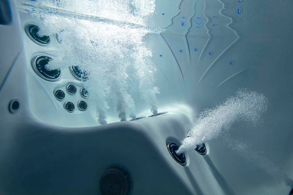 A hot tub with a lot of bubbles coming out of it.