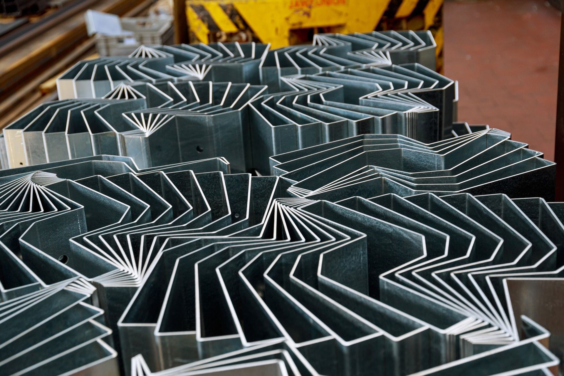 A Bunch of Metal Pieces Are Stacked on Top of Each Other — LM Engineering In Mareeba, QLD