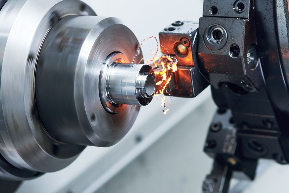 A Machine is Cutting a Piece of Metal on a Lathe — LM Engineering In Mareeba, QLD