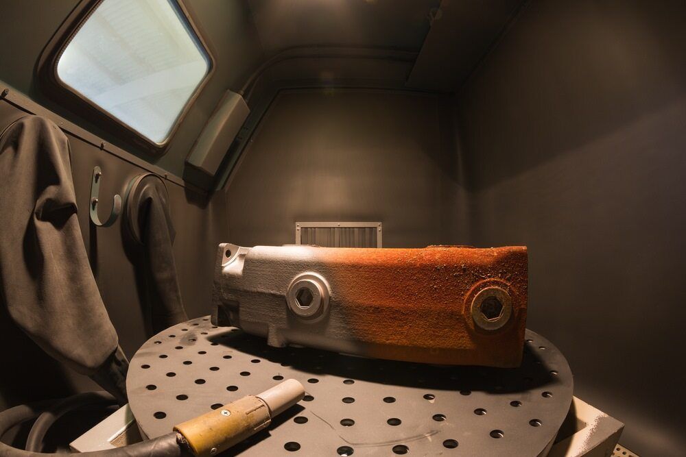 A Piece of Metal is Sitting on a Table in a Room — LM Engineering In Mareeba, QLD