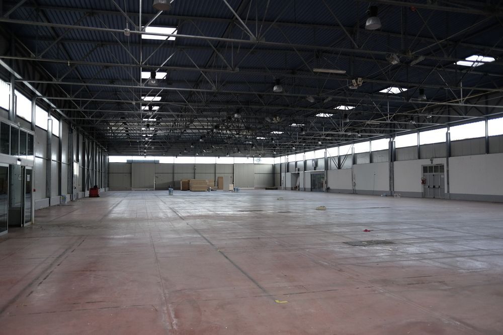 A Large Empty Warehouse With a Lot of Windows — LM Engineering In Mareeba, QLD